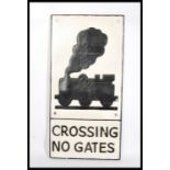 A reproduction cast iron railway Level Crossing sign. White, with black raised and painted notation.