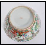 An early 20th Century 1920's Chinese bowl having hand painted famille rose cartouche panels
