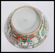 An early 20th Century 1920's Chinese bowl having hand painted famille rose cartouche panels