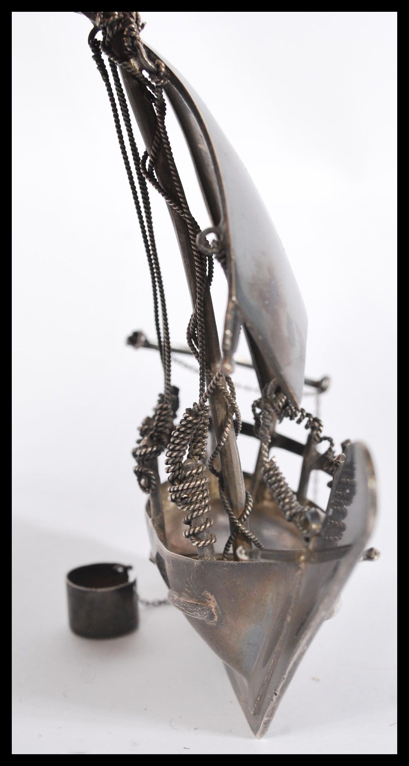 A silver / white metal model of a sailing box complete with sails moving bucket, rudder and ropes. - Image 4 of 4