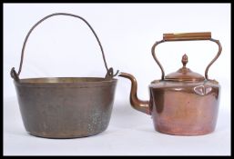 A 19th Century Victorian brass and copper kettle together with a similar aged brass and copper
