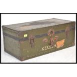 A vintage retro 20th Century Military shipping crate having various paper labels. Hinged lid opening