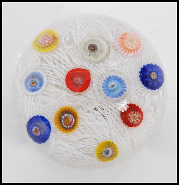 A 20th Century glass paperweight with random murrine canes atop a muslin ground cased in a clear - Image 3 of 6