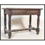 An 18th Century Jacobean peg jointed oak lowboy hall table / side table having a flared top over two