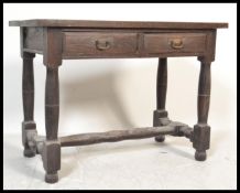 An 18th Century Jacobean peg jointed oak lowboy hall table / side table having a flared top over two