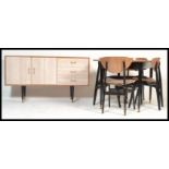 A retro 20th Century circa 1970's dining suite, consisting of a matching sideboard and extendable
