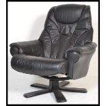 A retro 20th Century style black leather reclining swivel easy chair in the manner of Ekornes, the