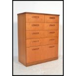 A retro 20th Century teak chest of drawers by Meredew. Having an arrangement of two short over