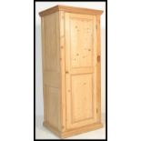 A 19th Century Victorian stripped / scrubbed  pine single door sentry batchelors wardrobe, shaped