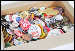 A collection of vintage advertising badges from the mid to late 20th Century to include Coca cola,