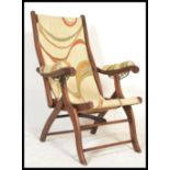 A Victorian mahogany folding campaign - steamer chair of beech construction having a mid century /
