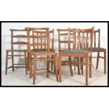 A collection of 20th century dining chairs to include mid century rail back dining chairs, chapel