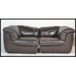 A contemporary / 20th centurty two piece modular leather sofa by Laauser comprising of two corner