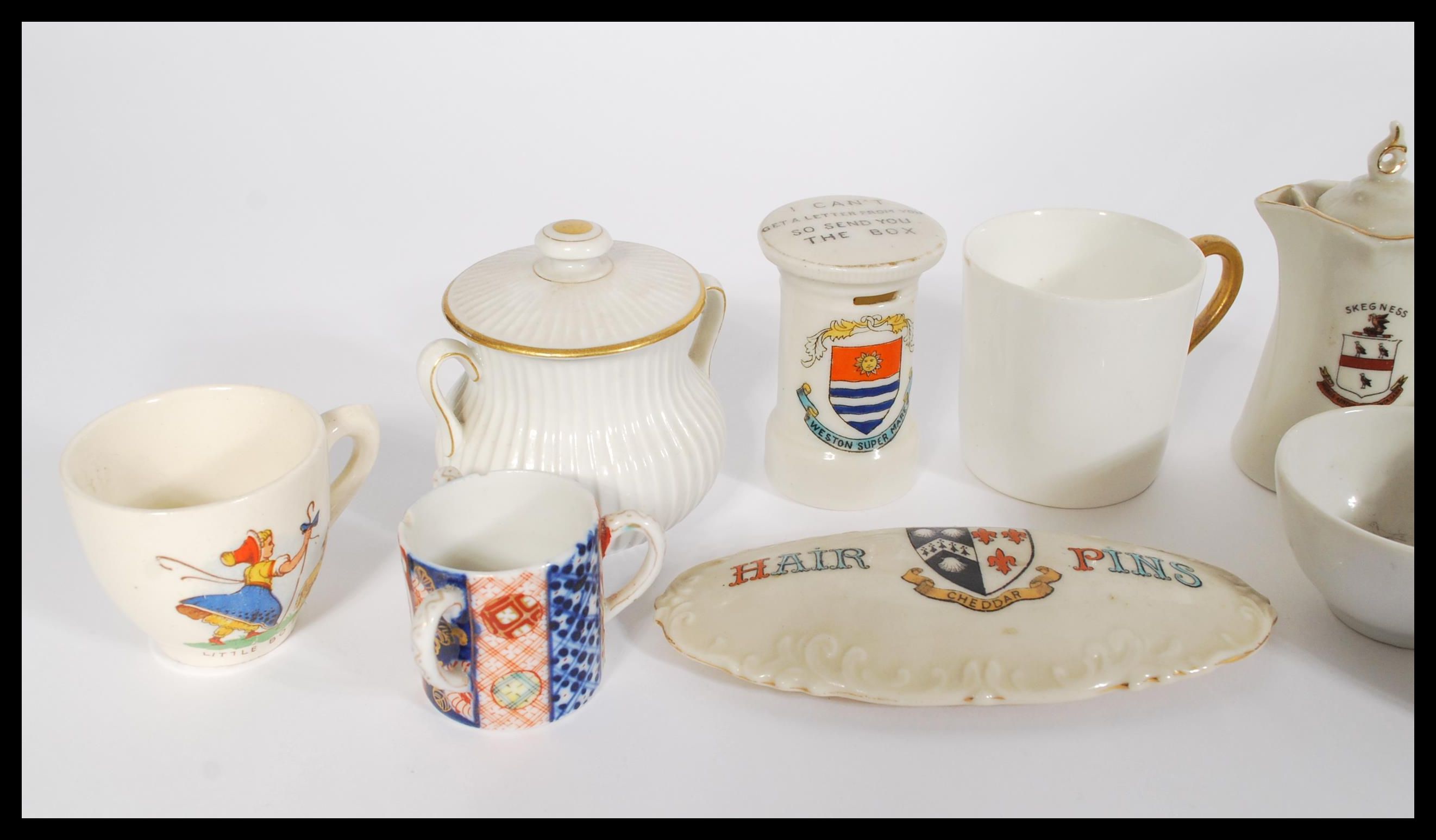 A collection of Goss souvenir ware ceramics to include teapot, mugs, post-box, coffee cans etc along - Image 2 of 4