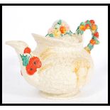 An early 20th century Clarice Cliff ' Celtic Harvest ware' teapot embossed fruit and wheat sheaf