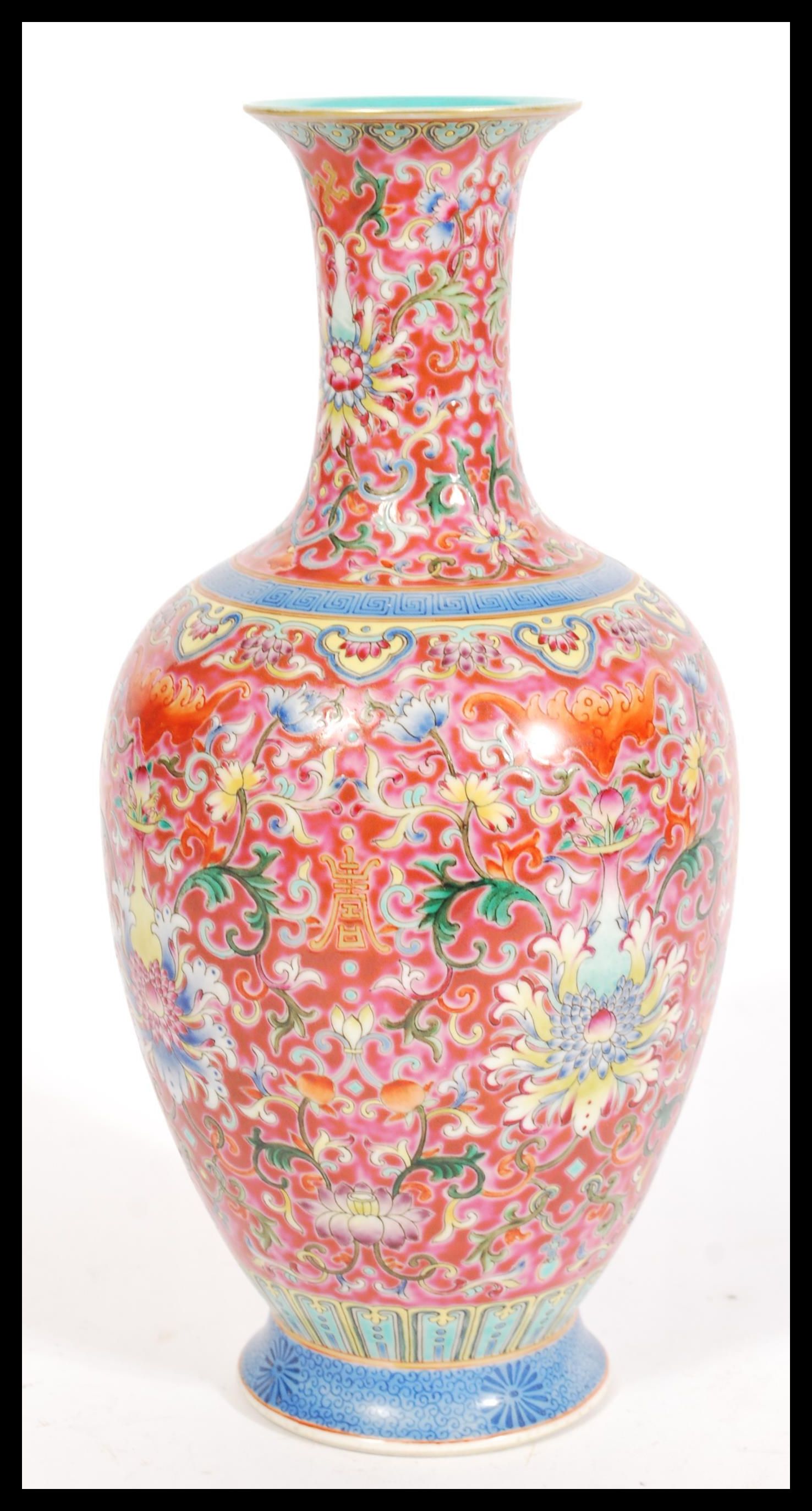 A Chinese Qianlong mark porcelain vase having fine enamel detailing on red ground. Hand decorated - Image 3 of 4