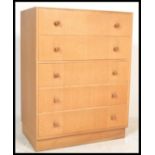 A mid century retro Meredew light oak chest of drawers. Raised on an inset plinth base with