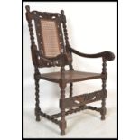 A 17th Century revival  oak carved armchair / chair dating to the Victorian period  The chair with