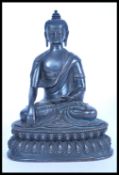 A 19th century Chinese bronze figurine of a Buddha raised on pedestal base and modelled in the lotus