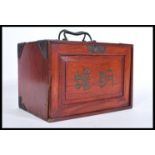 A vintage early 20th century Oriental Chinese Mahjong set, contained within a teak wood cabinet with