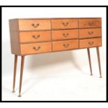 A 20th Century vintage industrial nine drawer sectional cabinet, each drawer with fitted with swag