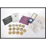 A collection of 15 Commemorative coins, to include gold plated and silver proof examples to incliude