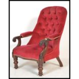 A 19th Century Victorian mahogany button back nursing chair of tub shape raised on scrolled supports