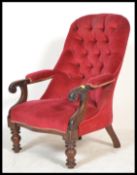 A 19th Century Victorian mahogany button back nursing chair of tub shape raised on scrolled supports