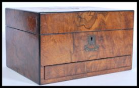 A 19th century George III walnut ladies vanity box complete with silver plate and glass contents