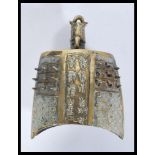 An early 20th century Chinese large brass bell having nail decoration with character marks and