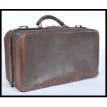 A vintage mid 20th Century leather Gladstone / Doctors bag, carry handle atop with full length brass