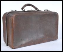 A vintage mid 20th Century leather Gladstone / Doctors bag, carry handle atop with full length brass