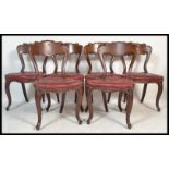 A set of six 19th Century Victorian mahogany kidney / balloon back dining chairs raised on