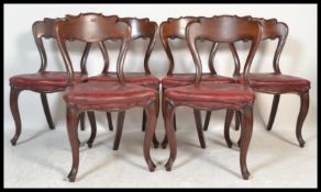 A set of six 19th Century Victorian mahogany kidney / balloon back dining chairs raised on