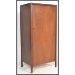 A mid century teak wood upright sentry box bachelors wardrobe with squared legs having full length