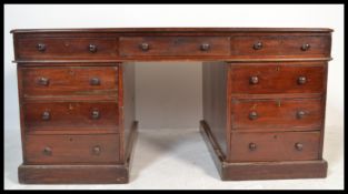 A good 19th century Victorian large mahogany partners desk having a green leather tooled inlaid