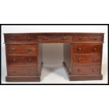 A good 19th century Victorian large mahogany partners desk having a green leather tooled inlaid