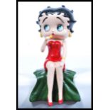 A cast iron door stop / advertising figure modelled as Betty Boop. Hand painted, depicting Boop