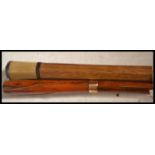 A pair of early 20th century Edwardian walking stick canes one having a tapering bamboo shaft with