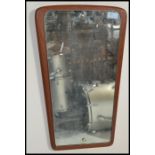 A vintage 20th century retro teak wood frameless atomic / sputnik style wall mirror of obtuse form