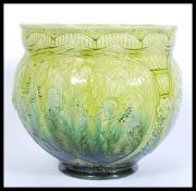 A late 19th century turquoise Burmantofts faience art pottery planter jardiniere vase having