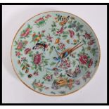 A 19th century Chinese Canton enamel charger plate having hand painted decoration of birds,