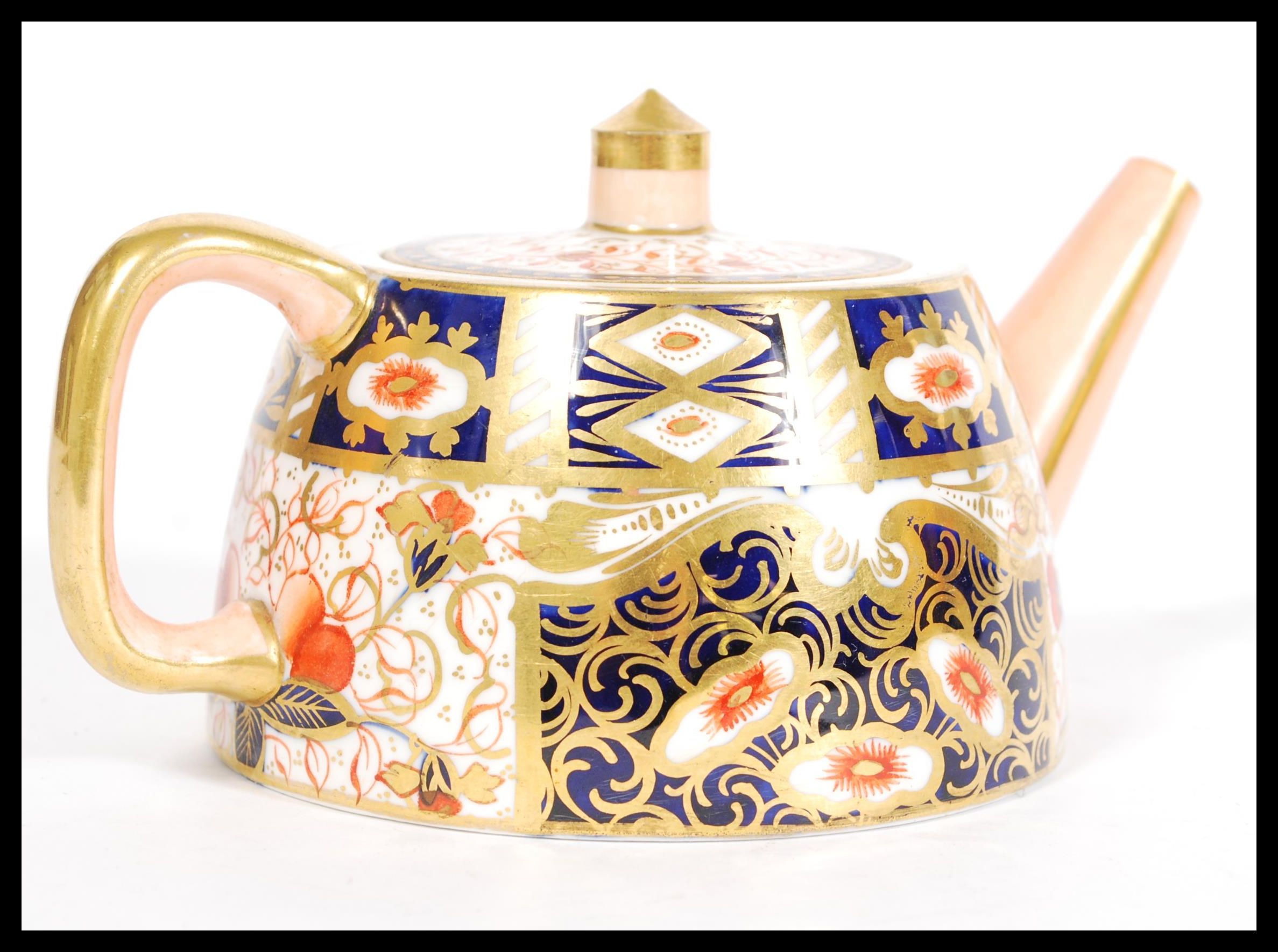 A 19th century Victorian Davenport China Imari pattern teapot of angular form being marked to the - Image 2 of 4