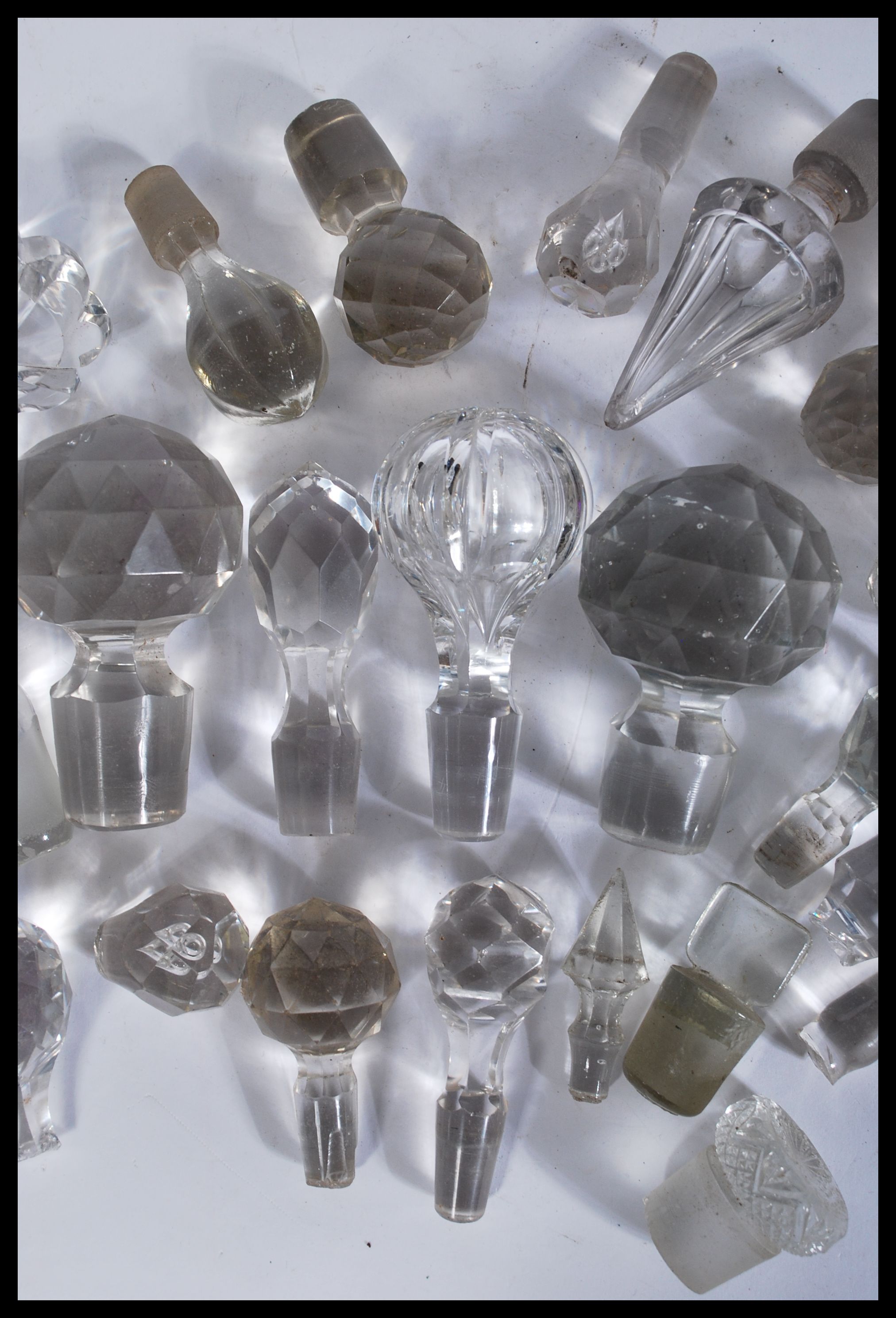 A collection of glass decanter / bottle stoppers of various forms most being crystal cut glass - Image 3 of 4