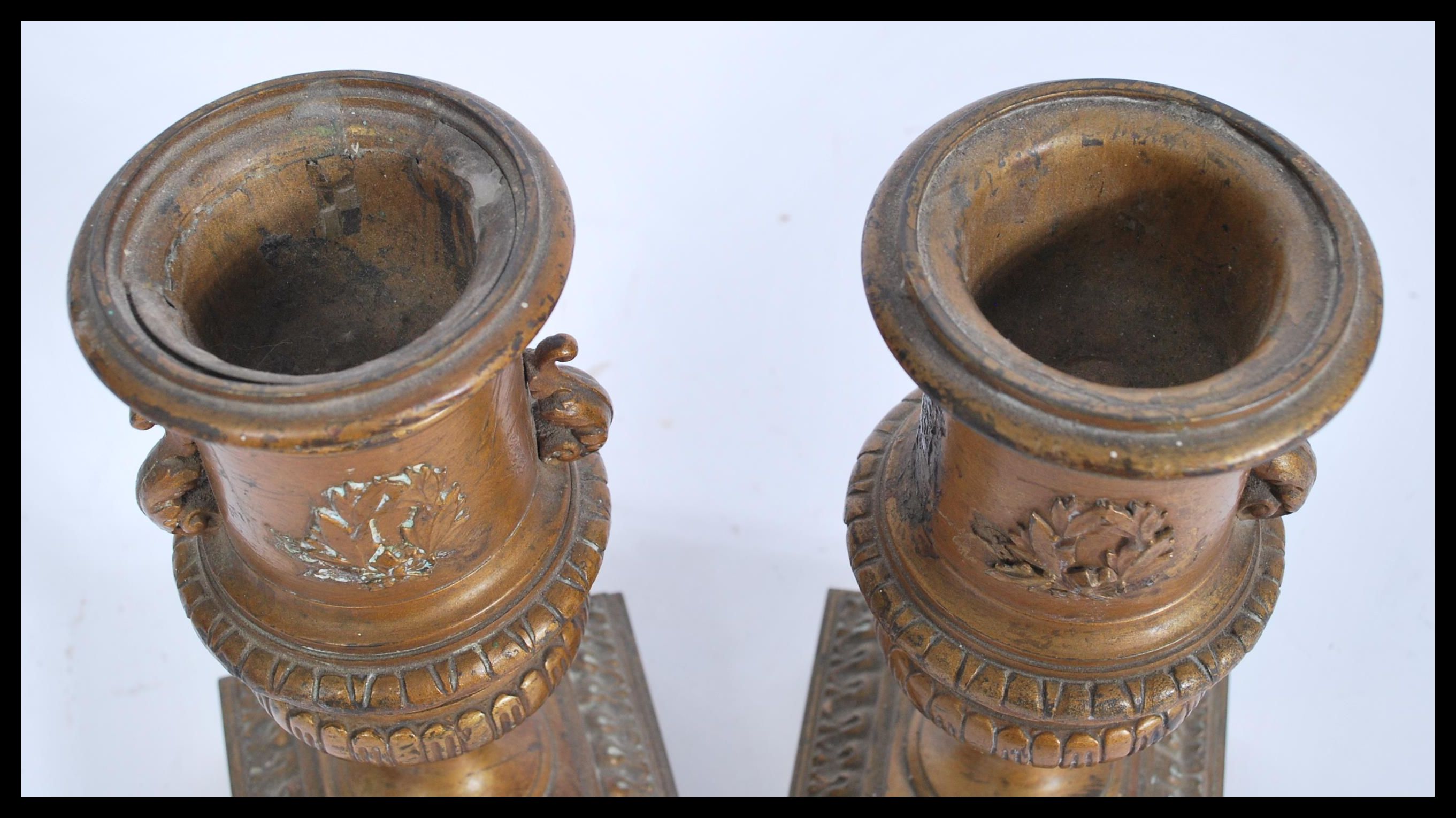 A pair of 19th century bronze urns raised on square bases with decorations of swags and ribbons with - Image 7 of 9