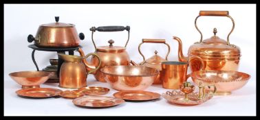 A collection of copper dating from the 19th Century to include riveted handled examples, measures