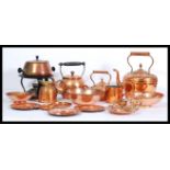 A collection of copper dating from the 19th Century to include riveted handled examples, measures