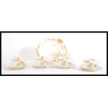 An Art Deco 1930's bone china tea set by Shelly, the set consisting of four trio's with transfer