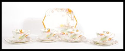 An Art Deco 1930's bone china tea set by Shelly, the set consisting of four trio's with transfer