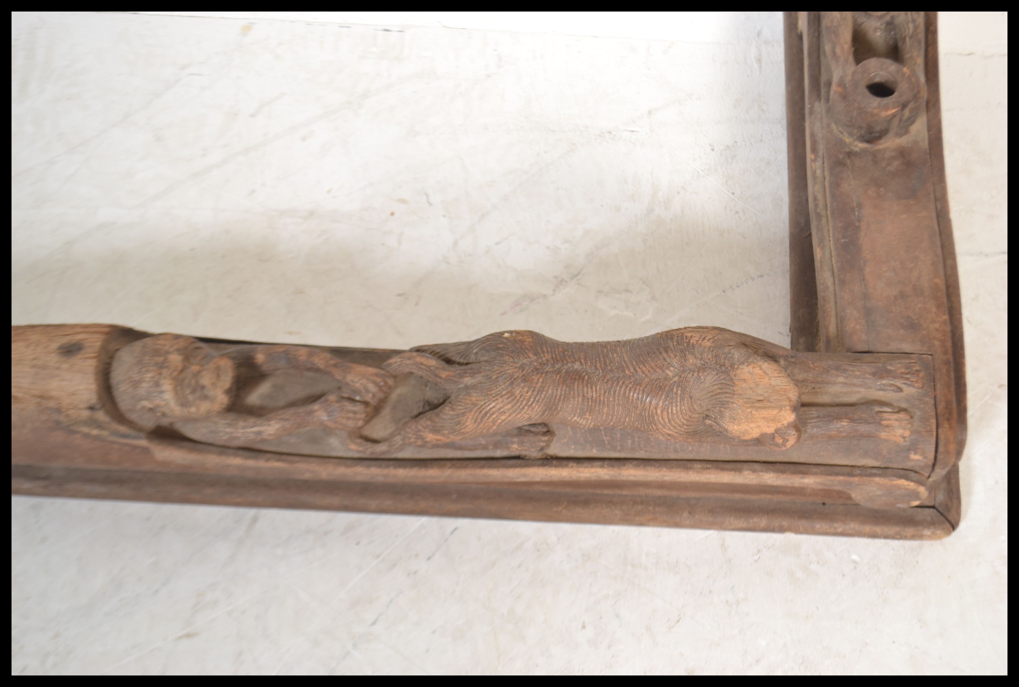 A vintage 20th Century carved oak fire fender kerb of African tribal inspiration, the fender heavily - Image 4 of 7